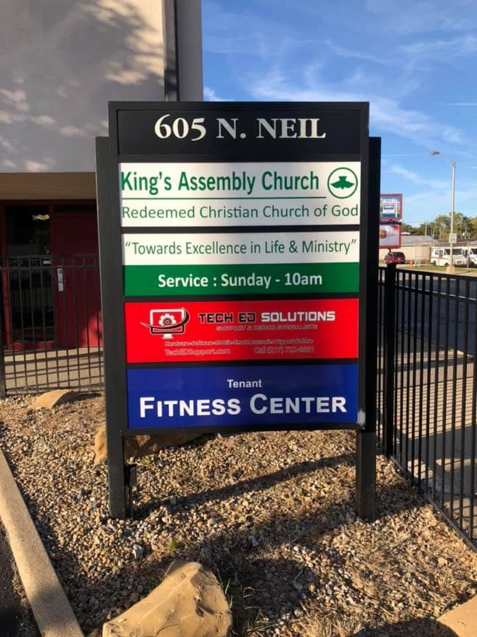 The 605 North Neil Street directory sign listing Tech Ed Solutions