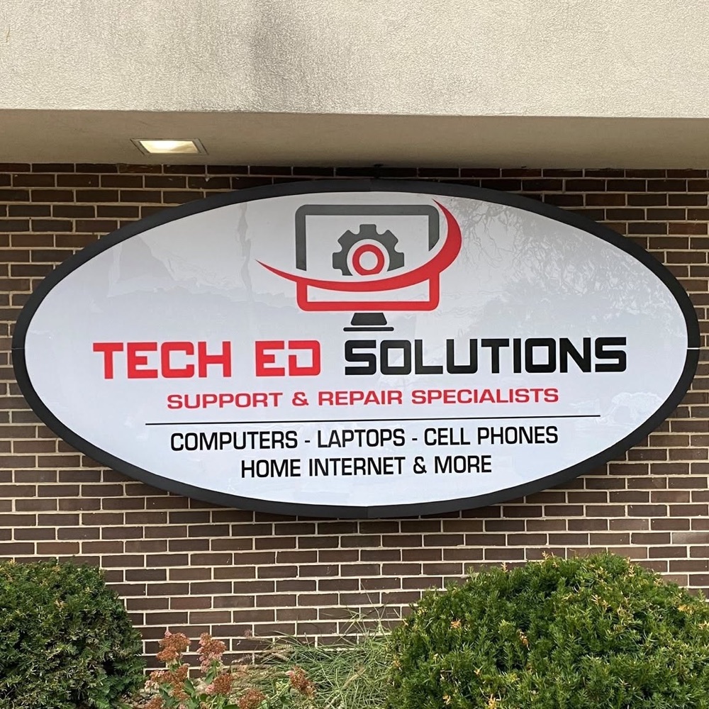 The Tech Ed Solutions sign on the building: support and repair specialists for computers, laptops, cell phones, and home internet