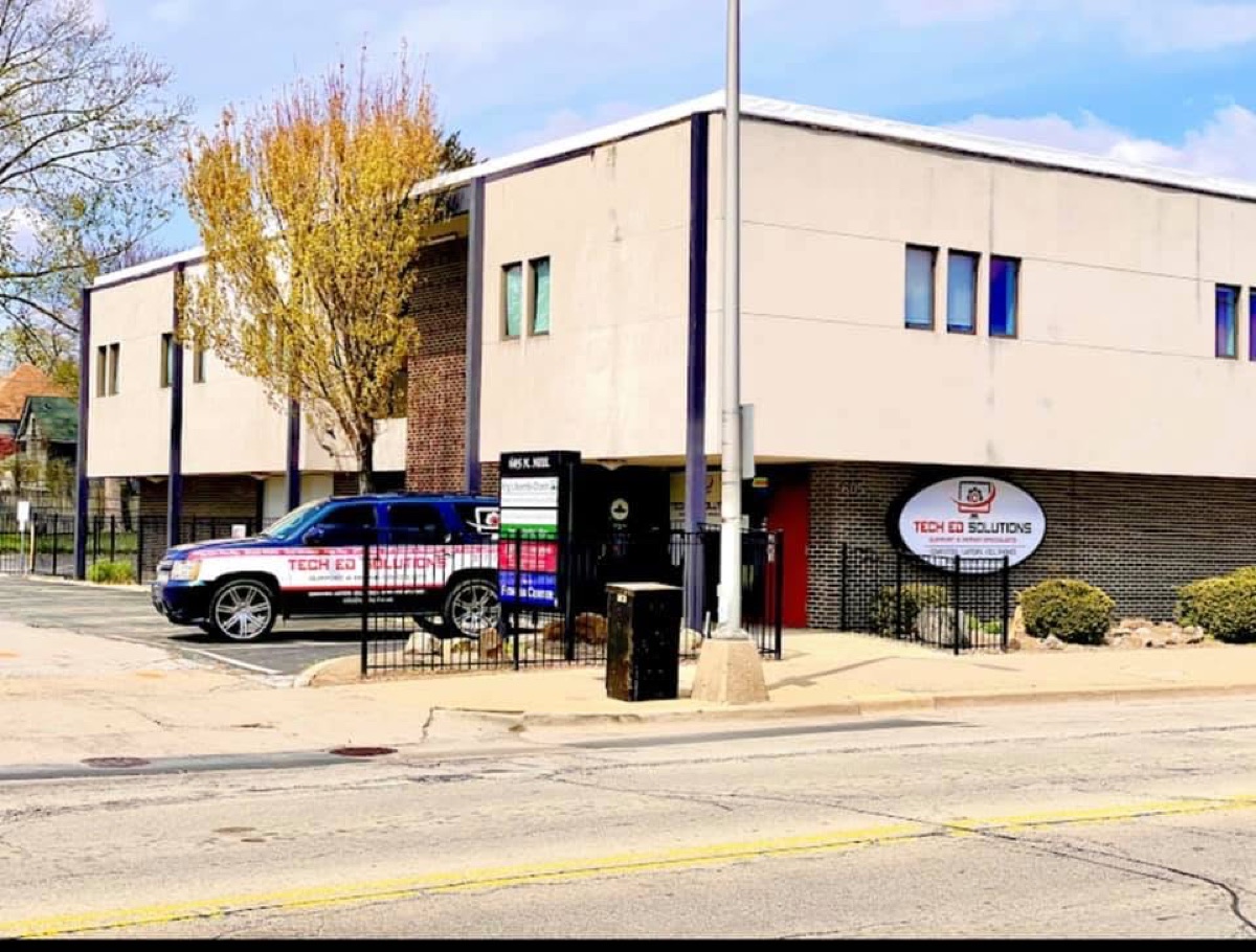 The Tech Ed Solutions building at 605 North Neil Street, with the company vehicle parked outside